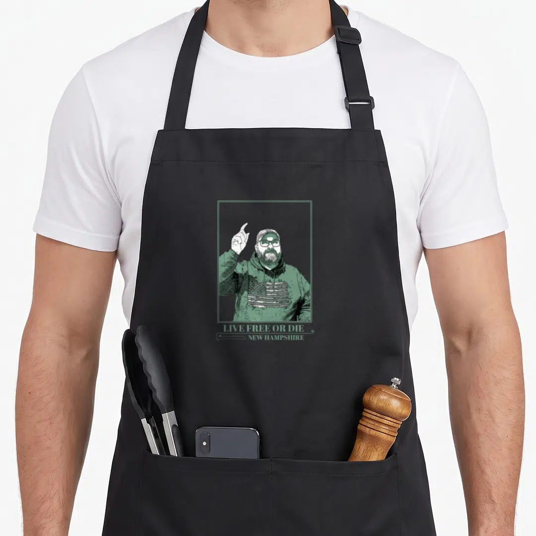 Jim screen printing apron - Green line art of a bearded man pointing up with text Live Free Or Die New Hampshire — shown on a black cotton canvas apron against a white background