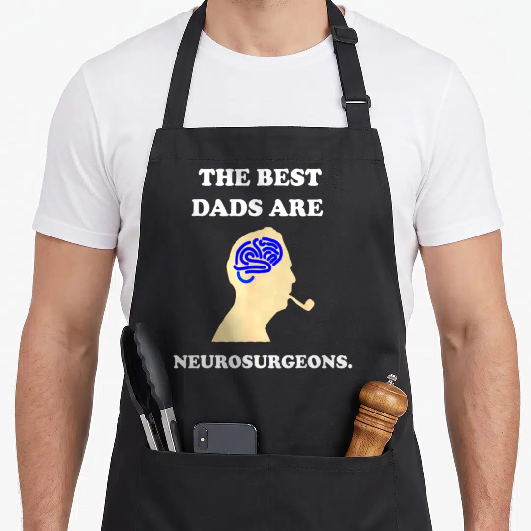 Neurosurgeon doctor with apron - Beige head silhouette with blue brain and white text reading THE BEST DADS ARE — shown on a black cotton canvas apron against a white background