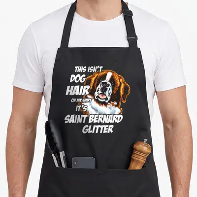 Hair saint dog apron - Realistic Saint Bernard head with text THIS ISN'T DOG HAIR ON MY SHIRT IT'S SAINT BERNARD GLITTER — shown on a black cotton canvas apron against a white background