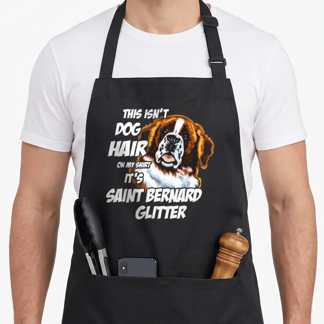 Hair saint dog apron - Realistic Saint Bernard head with text THIS ISN'T DOG HAIR ON MY SHIRT IT'S SAINT BERNARD GLITTER — shown on a black cotton canvas apron against a white background