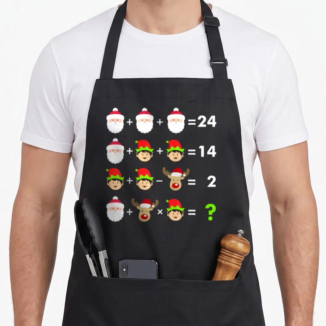 Teacher christmas apron - Four rows of math equations with Santa, elf, and reindeer heads ending in equals signs — shown on a black cotton canvas apron against a white background