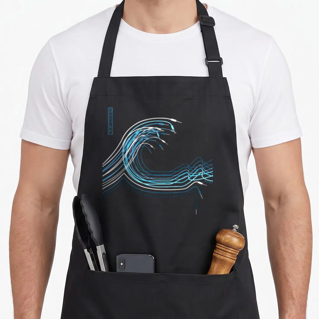 Wave synthesizer apron - Minimalist wave of blue and white audio cables with jacks and MEWLEERT text — shown on a black cotton canvas apron against a white background