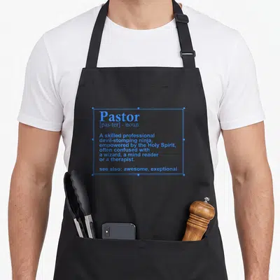 Definition christian apron - Blue dictionary definition of Pastor describing a devil-stomping ninja empowered — shown on a black cotton canvas apron against a white background