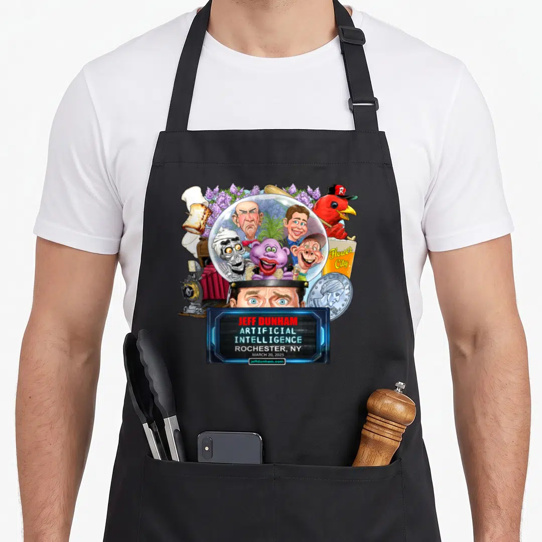Dunham rochester apron - Jeff Dunham Artificial Intelligence 2025 puppet collage with Flower City sign and lilacs — shown on a black cotton canvas apron against a white background