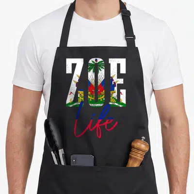 Haiti haitian apron - ZOE filled with Haitian coat of arms, L'UNION FAIT LA FORCE ribbon, and life script in distressed — shown on a black cotton canvas apron against a white background