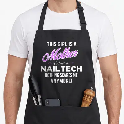 Mother manicurist apron - White and purple typography reading THIS GIRL IS A Mother And a NAIL TECH NOTHING SCARES ME — shown on a black cotton canvas apron against a white background