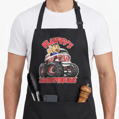 Gabriel truck aprons - Cartoon man thumbs up in red white monster bus with Fluffy's Monster Bus text — shown on a black cotton canvas apron against a white background