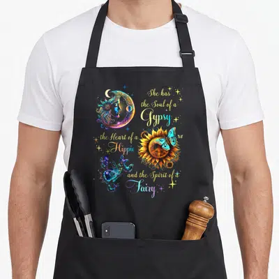 Soul hippie apron - Crescent moon, sunflower with peace sign, blue butterflies, and gypsy hippie fairy quote in yellow — shown on a black cotton canvas apron against a white background