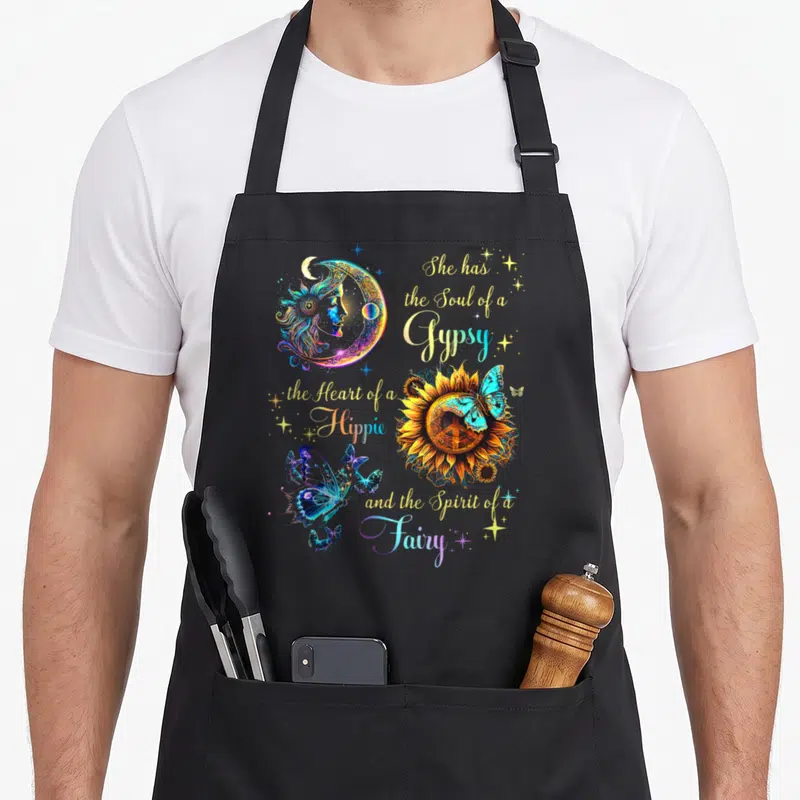 Soul hippie apron - Crescent moon, sunflower with peace sign, blue butterflies, and gypsy hippie fairy quote in yellow — shown on a black cotton canvas apron against a white background