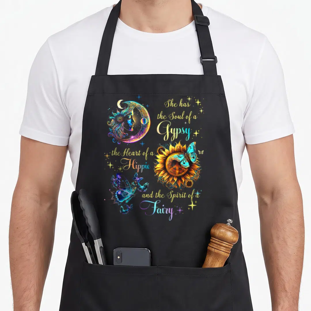 Soul hippie apron - Crescent moon, sunflower with peace sign, blue butterflies, and gypsy hippie fairy quote in yellow — shown on a black cotton canvas apron against a white background
