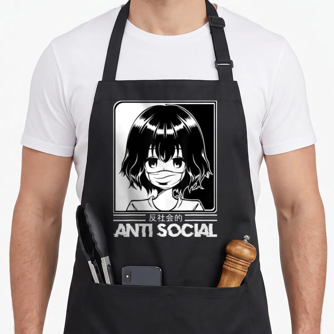 Anti japan apron - Anime girl in frame with anti social text and Japanese characters — shown on a black cotton canvas apron against a white background