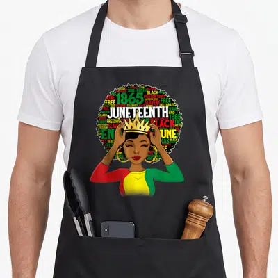 Juneteenth queen african american aprons - Crowned woman with afro filled with Juneteenth 1865 Freedom Slavery text — shown on a black cotton canvas apron against a white background