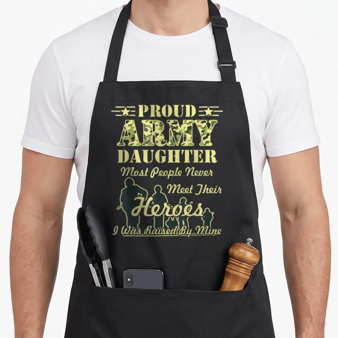Army proud parent apron - Stacked text Proud Army Daughter with camo fill and soldier silhouettes on grey background — shown on a black cotton canvas apron against a white background