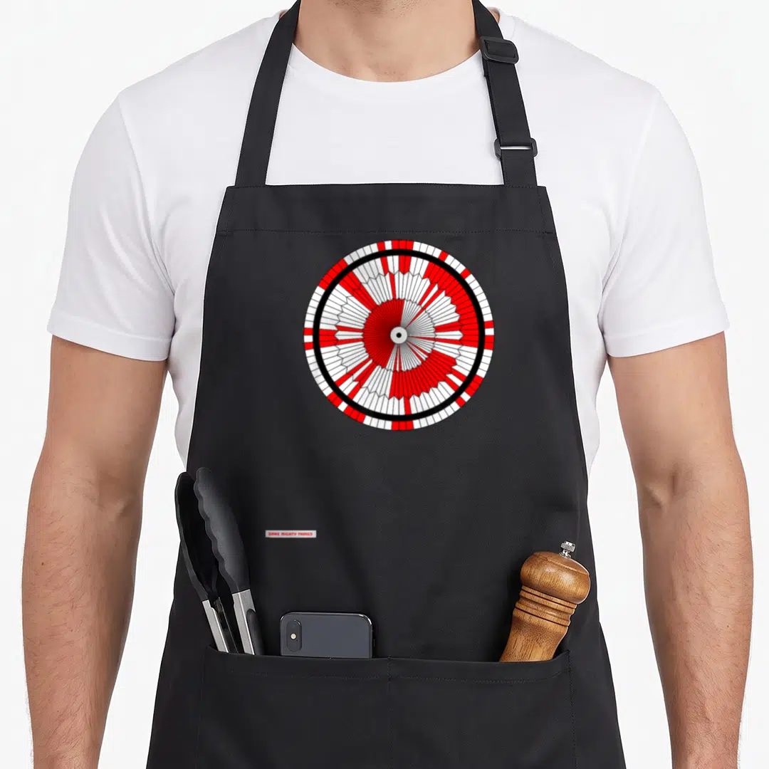 Dare jet girl apron - Red white black circular parachute graphic with Dare Mighty Things text watermark — shown on a black cotton canvas apron against a white background
