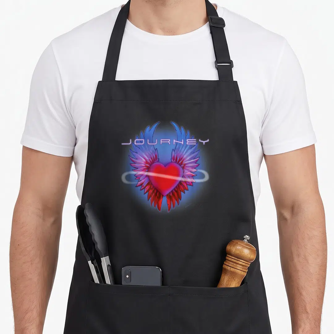Journey infinity apron - Red heart with blue and purple wings under JOURNEY text — shown on a black cotton canvas apron against a white background