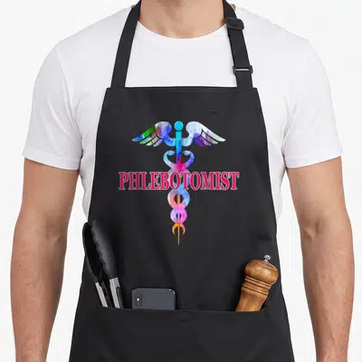 Phlebotomy phlebotomist apron - Watercolor caduceus in pink blue purple green yellow with horizontal PHLEBOTOMIST text — shown on a black cotton canvas apron against a white background