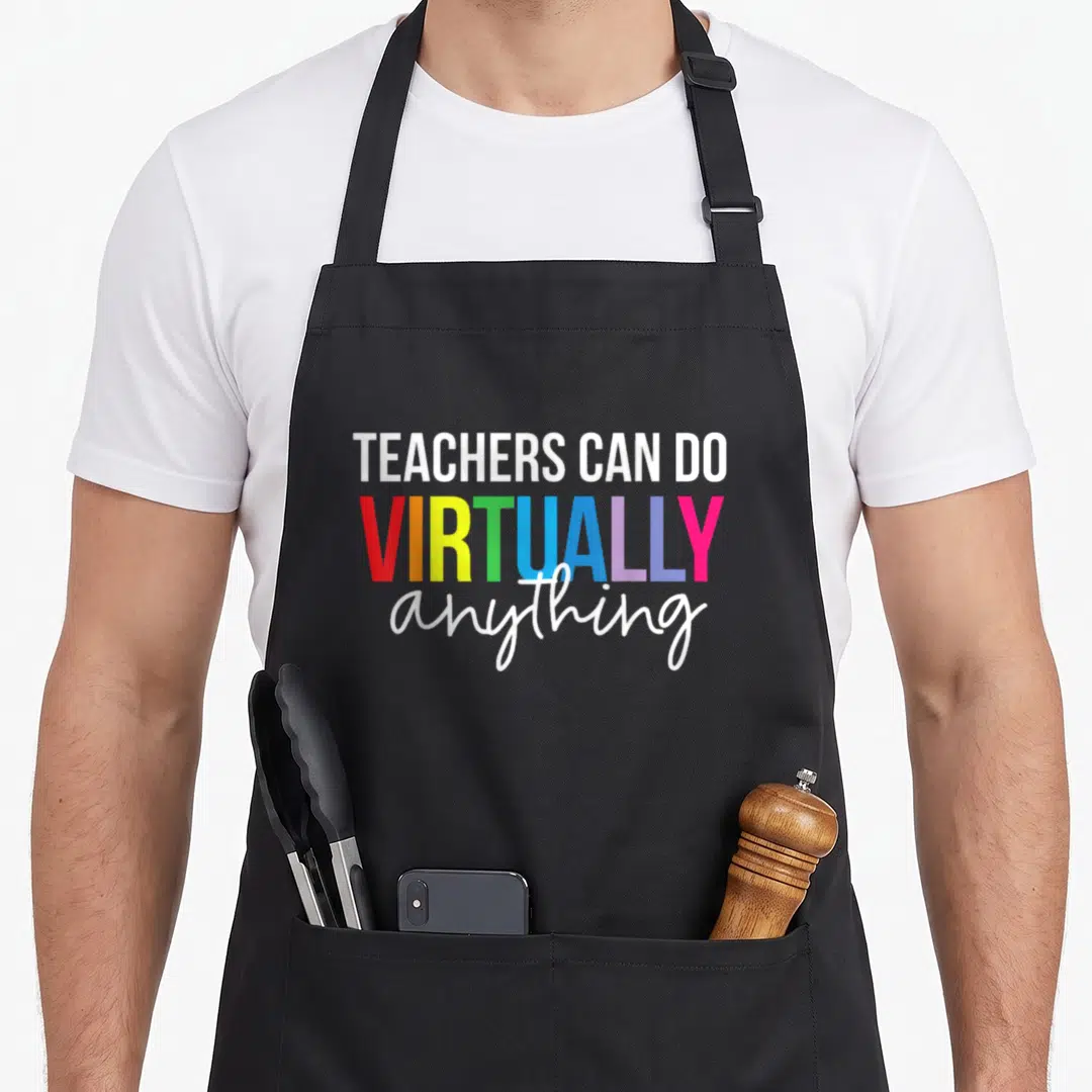 Virtually anything teacher apron - Colorful rainbow text reading TEACHERS CAN DO VIRTUALLY anything in stacked — shown on a black cotton canvas apron against a white background