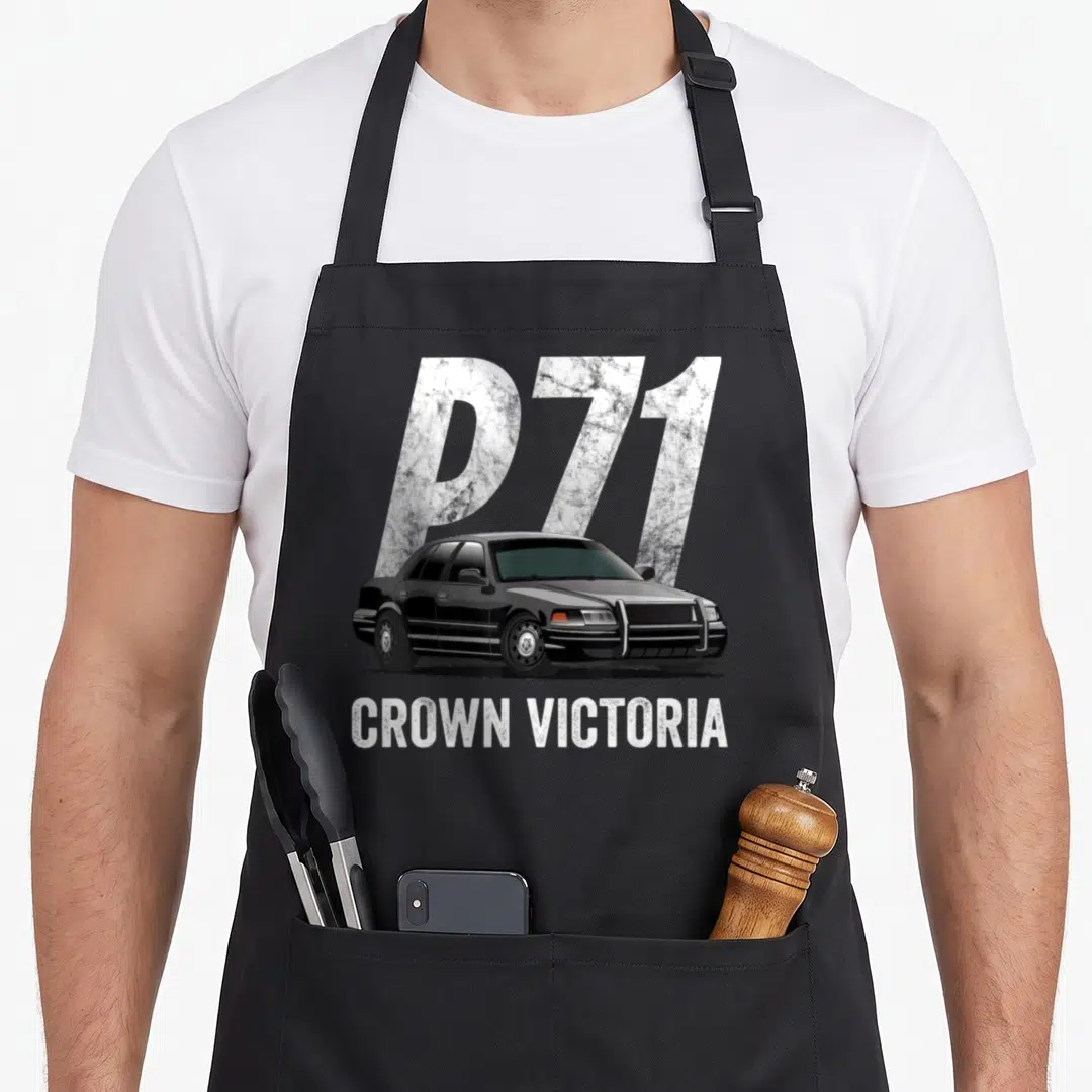 Car police apron - Black Crown Victoria sedan with large silver P71 background text and white CROWN VICTORIA label below — shown on a black cotton canvas apron against a white background
