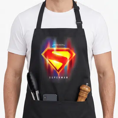 Glowing choice aprons - Glowing red yellow S-shield with white quote text and blurred colorful background — shown on a black cotton canvas apron against a white background