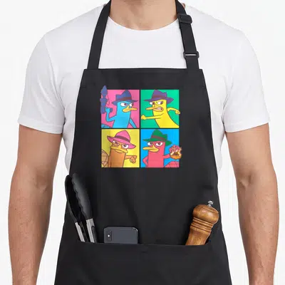 Phineas box apron - Four colored platypuses in fedoras arranged in a 2x2 cartoon grid — shown on a black cotton canvas apron against a white background