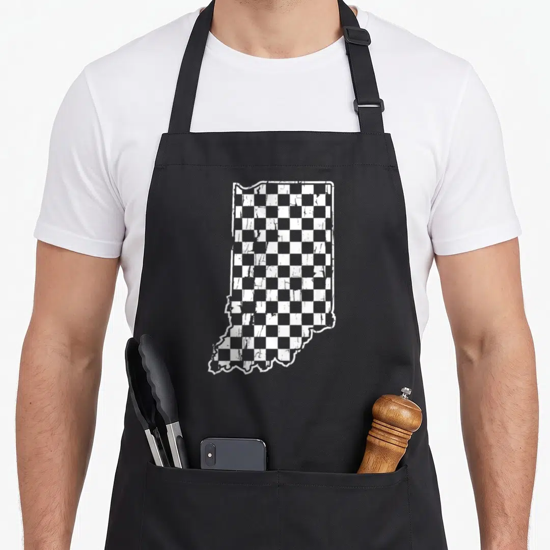 Indianapolis indycar apron - Indiana state map silhouette filled with distressed white and grey checkerboard pattern — shown on a black cotton canvas apron against a white background