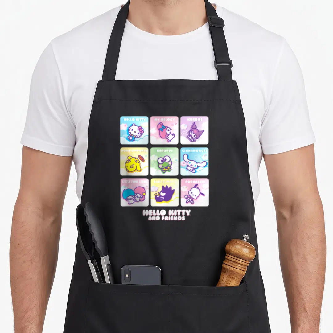 Square friends apron - Nine cartoon character squares in pink blue yellow purple green with names Hello Kitty My Melody — shown on a black cotton canvas apron against a white background