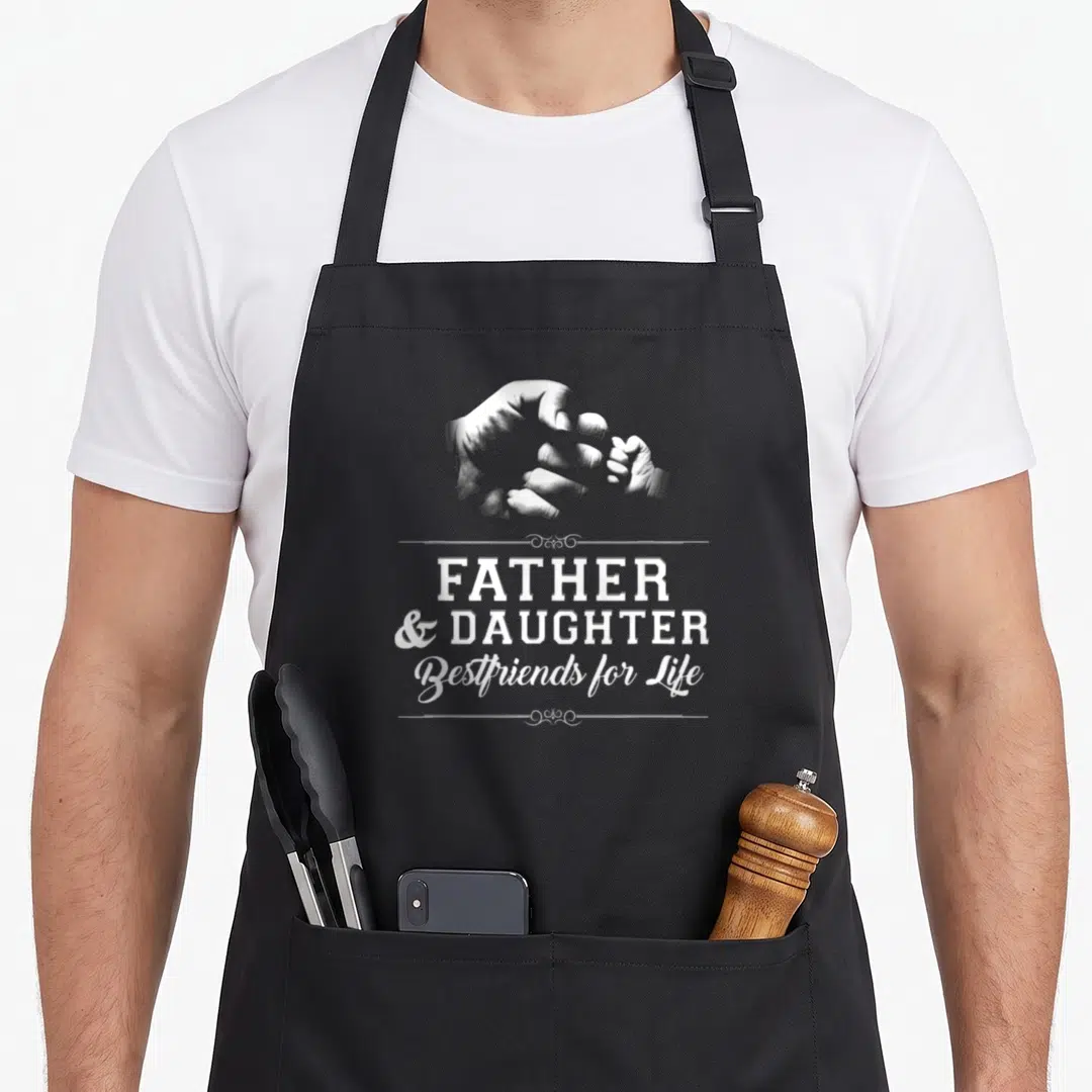 Fist father day apron - White fist bump illustration above Father Daughter Bestfriends for Life text — shown on a black cotton canvas apron against a white background