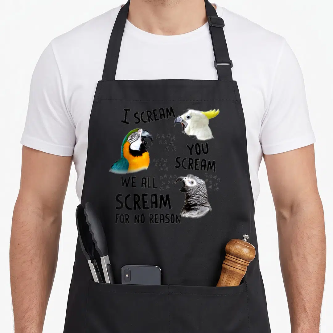 Scream crazy parrot man apron - Three bird heads with I scream text and grey A clusters — shown on a black cotton canvas apron against a white background