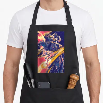 Galactus first steps apron - Giant robot and surfer in retro blue yellow red purple space art — shown on a black cotton canvas apron against a white background