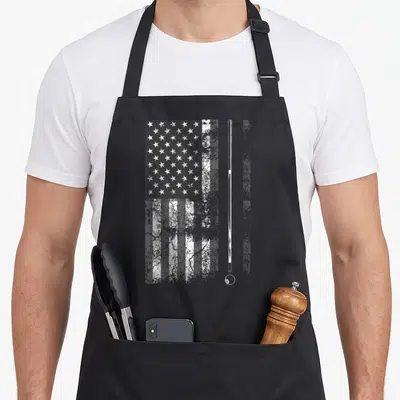 Billiard american flag apron - Distressed USA flag with vertical pool cue and 8-ball in white and grey tones — shown on a black cotton canvas apron against a white background