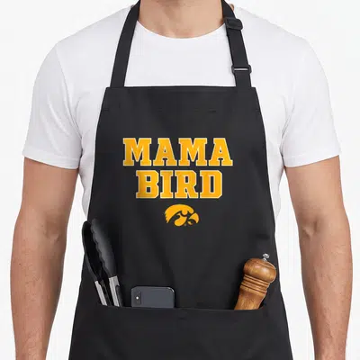 Mama bird apron - Yellow MAMA BIRD text stacked above a stylized hawk head logo in matching yellow — shown on a black cotton canvas apron against a white background