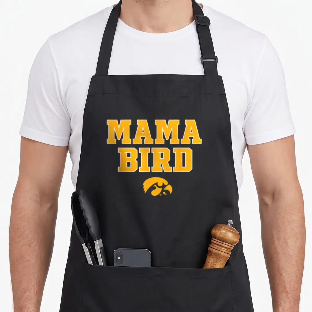 Mama bird apron - Yellow MAMA BIRD text stacked above a stylized hawk head logo in matching yellow — shown on a black cotton canvas apron against a white background