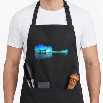 Guitar vulture mom apron - Blue and white landscape forming a guitar silhouette with a mirrored reflection below — shown on a black cotton canvas apron against a white background