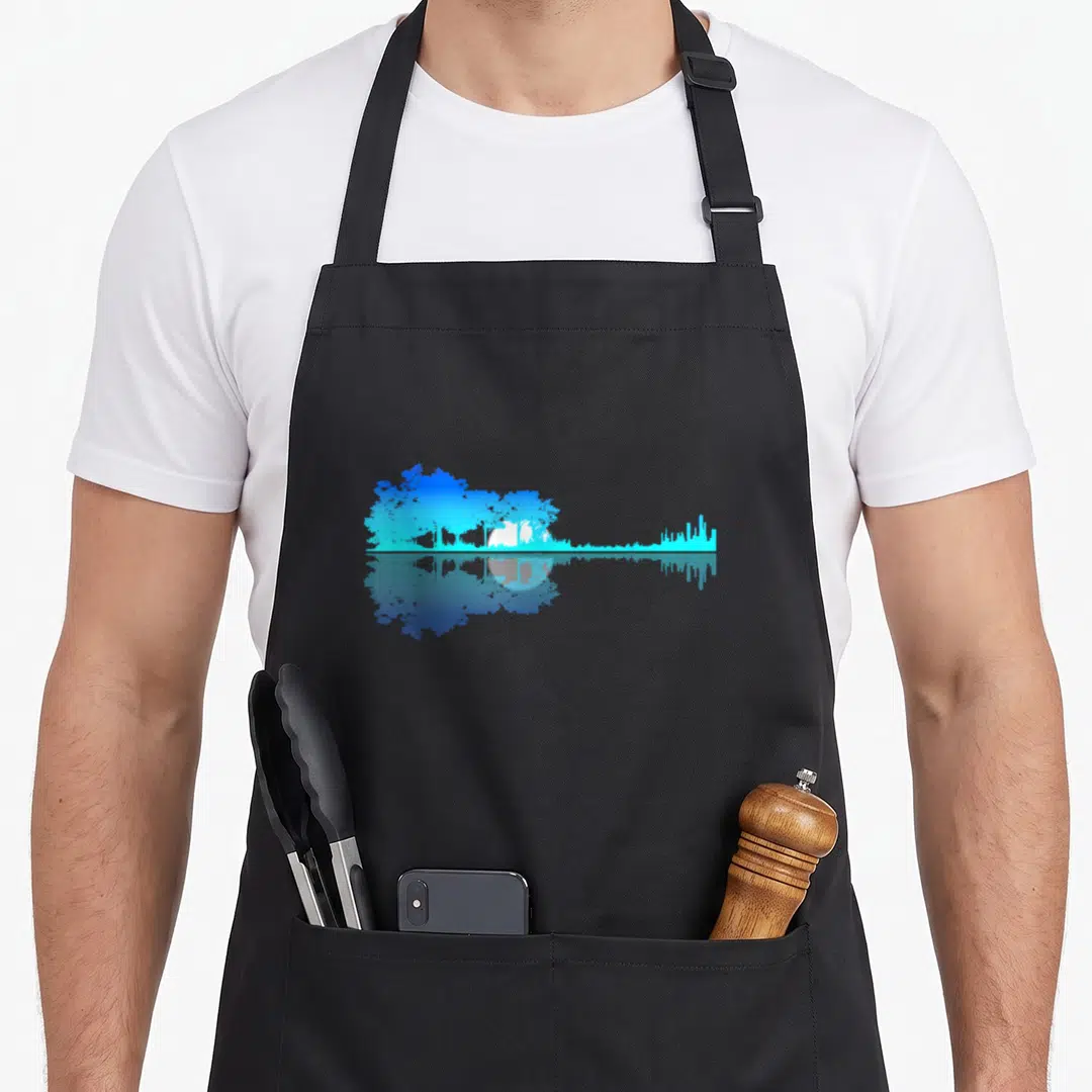 Guitar vulture mom apron - Blue and white landscape forming a guitar silhouette with a mirrored reflection below — shown on a black cotton canvas apron against a white background