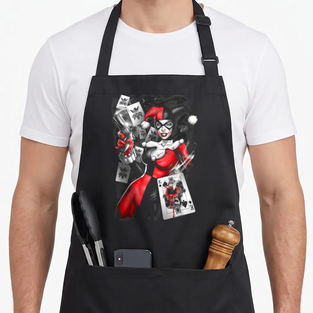 Smoking vehicle apron - Cartoon figure holding gun surrounded by scattered playing cards in red and grey — shown on a black cotton canvas apron against a white background