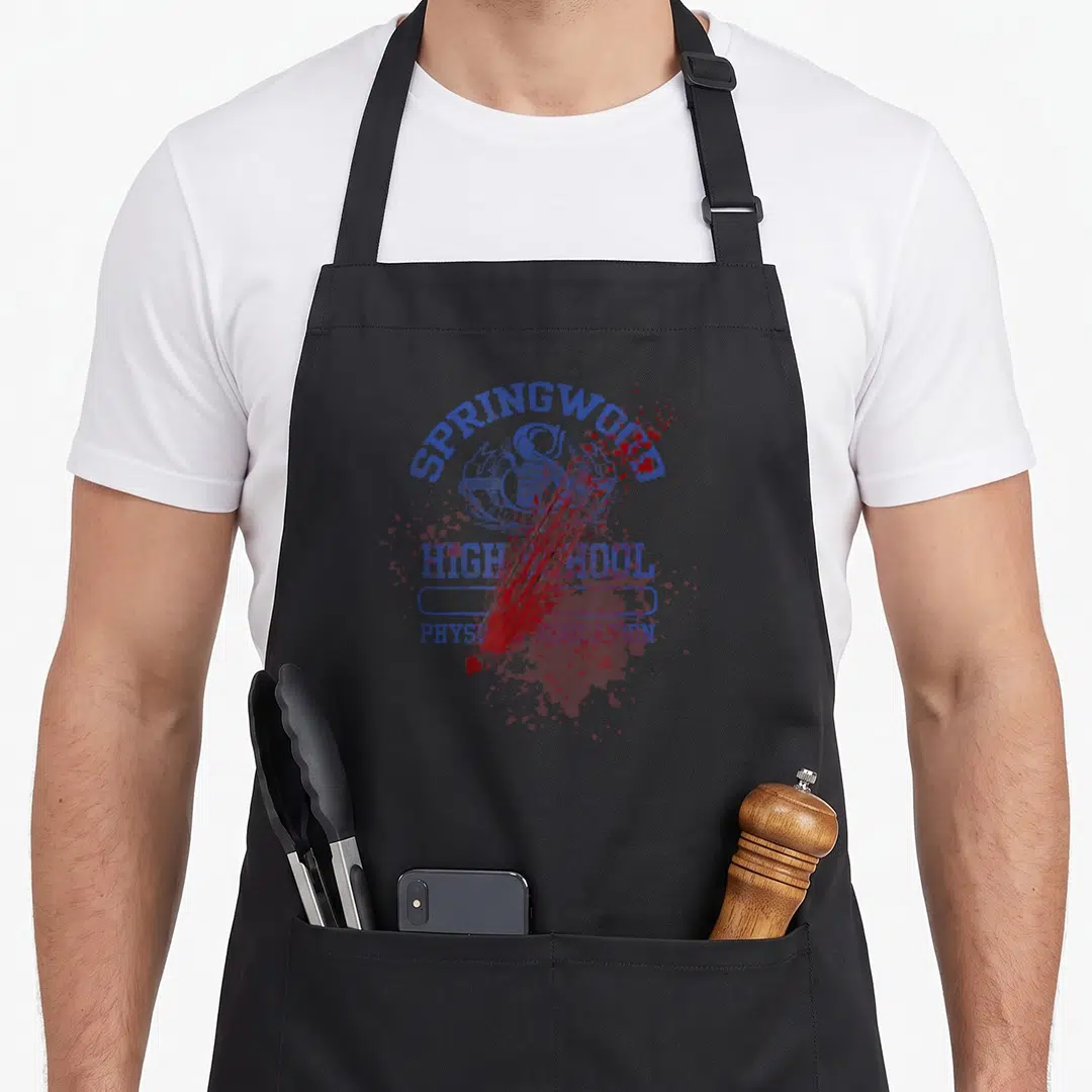 Street elm apron - Blue Springwood High School PE logo with red blood splatters and distressed texture — shown on a black cotton canvas apron against a white background