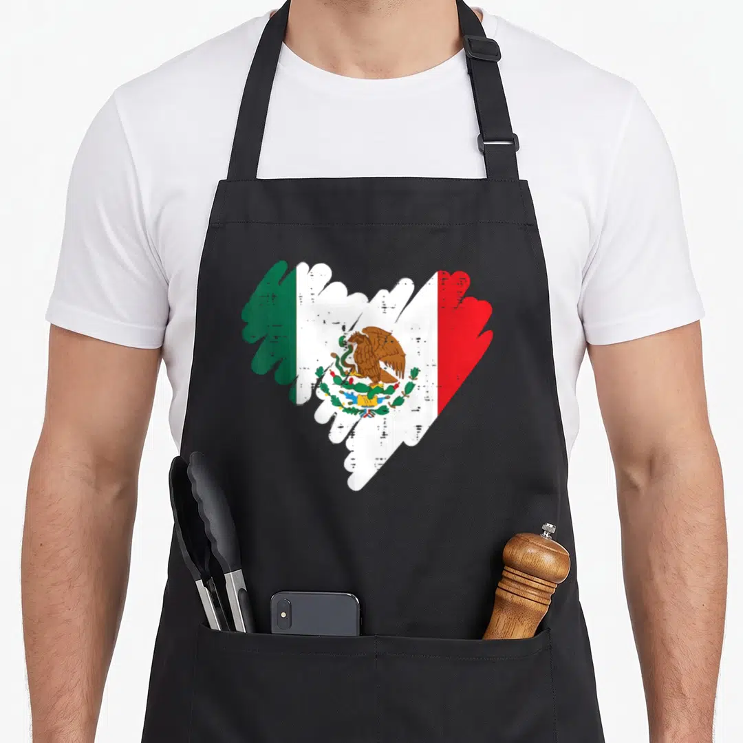 Flag mexican mexico apron - Distressed heart shape filled with green white red flag stripes and brown eagle cactus — shown on a black cotton canvas apron against a white background