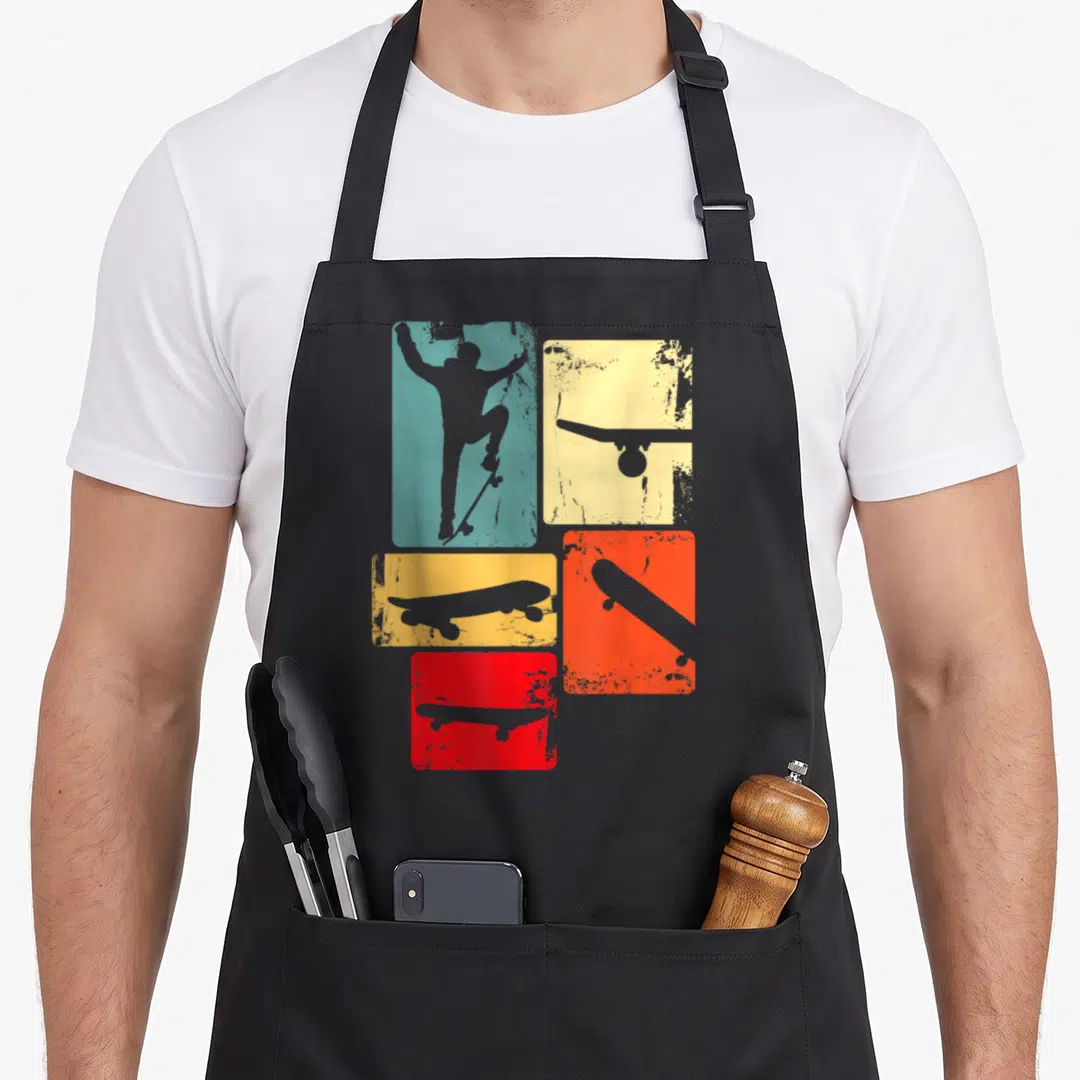 Youth best skater skateboarder accessories stuff apron - Retro teal skater silhouette and grey skateboards inside — shown on a black cotton canvas apron against a white background
