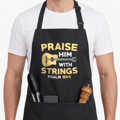 Bass christian apron - Yellow acoustic guitar with PRAISE HIM WITH STRINGS text and Psalms reference — shown on a black cotton canvas apron against a white background