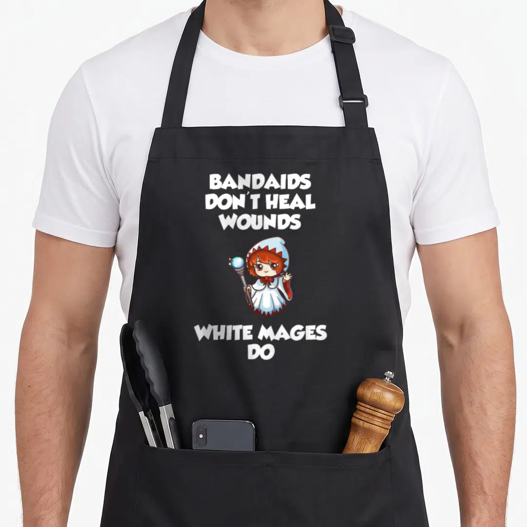 Bandaid mmorpg apron - Cartoon white mage with staff and text BANDAIDS DON'T HEAL WOUNDS WHITE MAGES DO — shown on a black cotton canvas apron against a white background