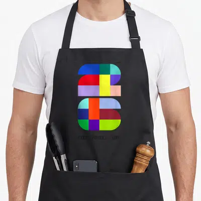 Fifa world cup apron - Multicolored geometric 2026 graphic above FIFA WORLD CUP text on black fabric — shown on a black cotton canvas apron against a white background