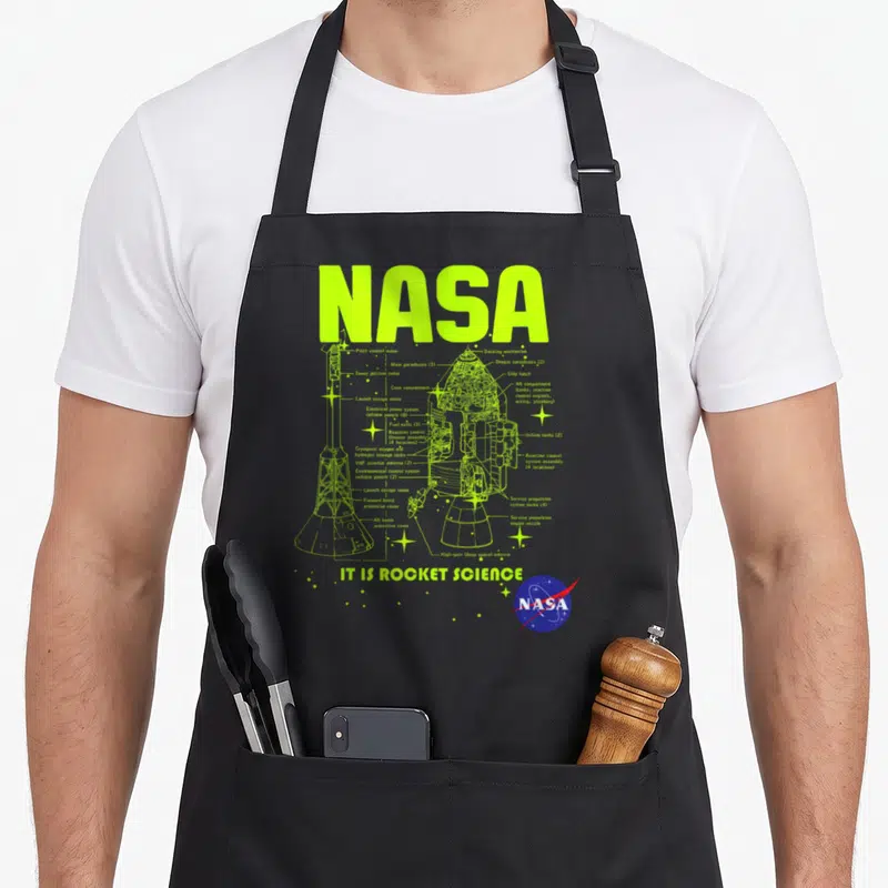 Module nasa apron - Apollo spacecraft schematic diagram with labeled parts and IT IS ROCKET SCIENCE text in neon green — shown on a black cotton canvas apron against a white background