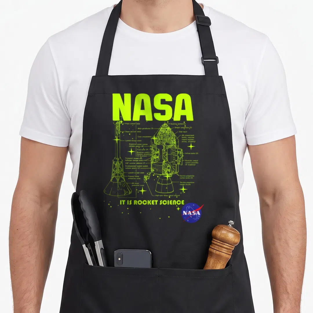 Module nasa apron - Apollo spacecraft schematic diagram with labeled parts and IT IS ROCKET SCIENCE text in neon green — shown on a black cotton canvas apron against a white background