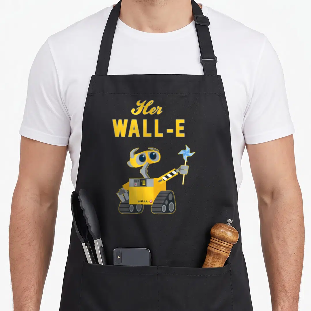 Wall couple apron - Yellow WALL-E robot holding blue pinwheel under stacked yellow text reading Her WALL-E — shown on a black cotton canvas apron against a white background