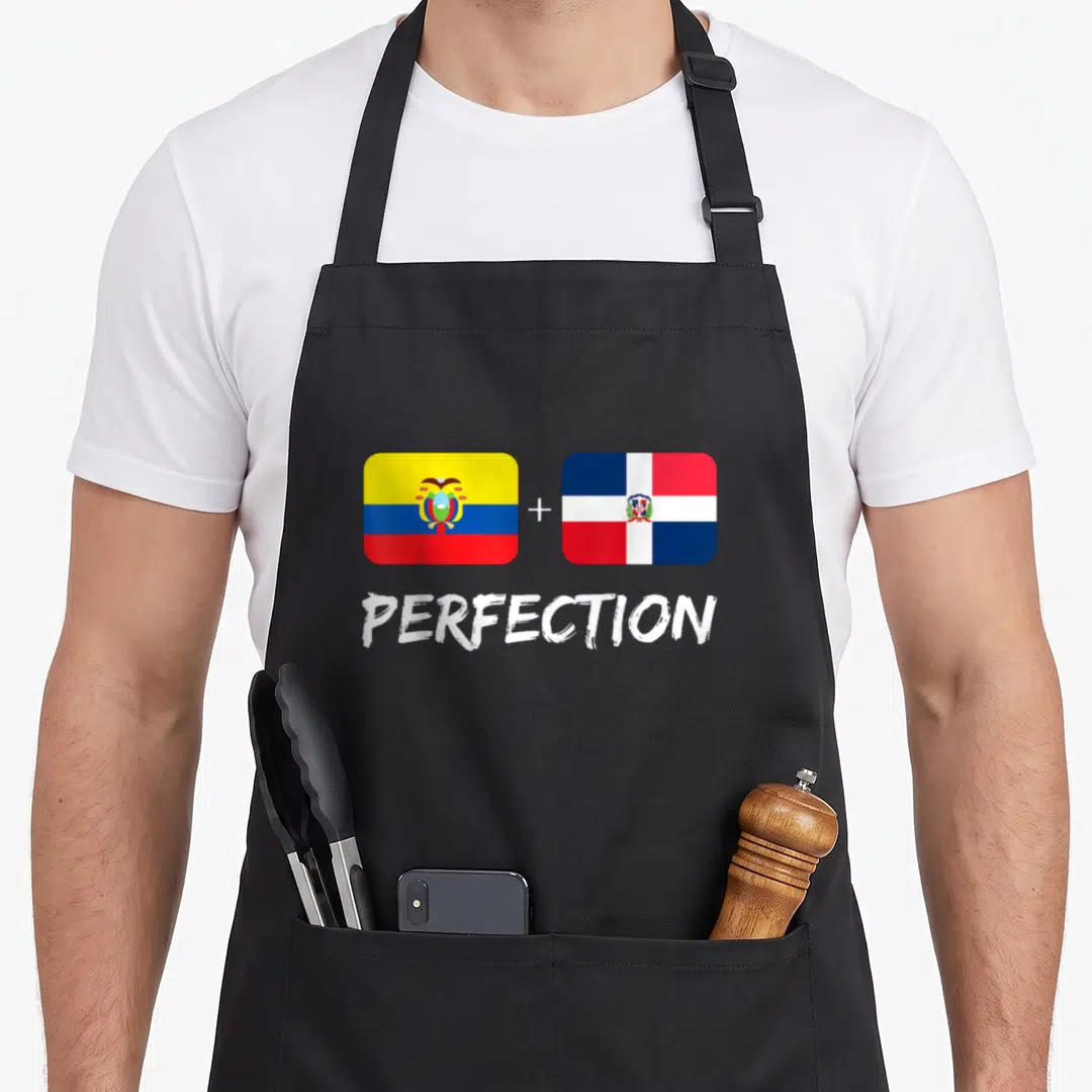 Ecuadorian dominican perfection heritage aprons - Two flags with plus sign and word PERFECTION in white text — shown on a black cotton canvas apron against a white background