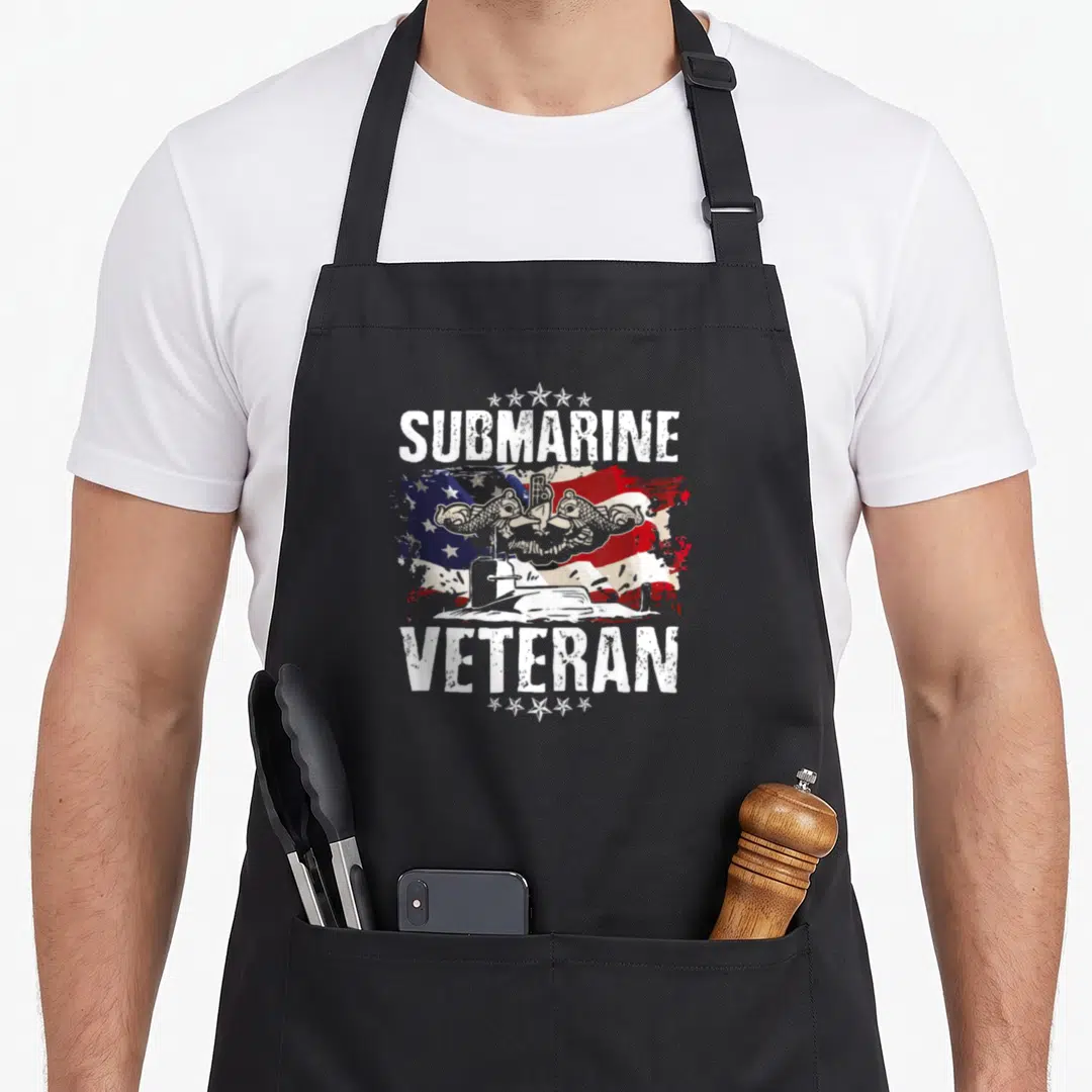 Submarine veteran submariner military apron - Distressed US flag with two dolphins, submarine, and text SUBMARINE — shown on a black cotton canvas apron against a white background