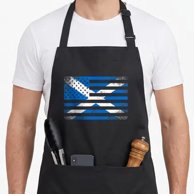 Scottish proud american flag apron - Distressed blue and white flag with horizontal gaps and star field overlay — shown on a black cotton canvas apron against a white background