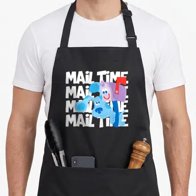 Mail novelty apron - Blue cartoon dog with purple mailbox over four white MAIL TIME text lines — shown on a black cotton canvas apron against a white background