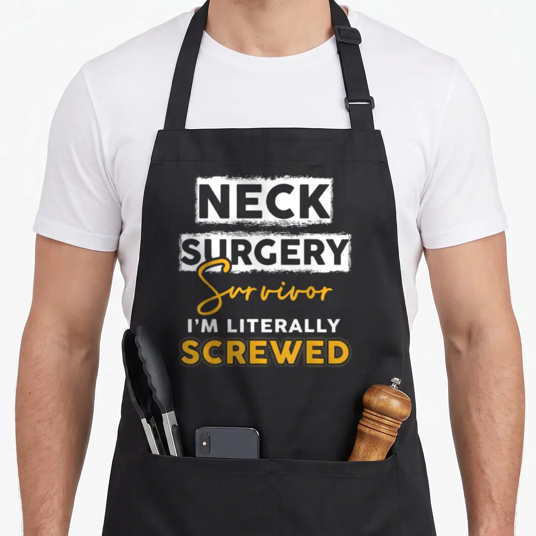 Surgery recovery day apron - Neck Surgery Survivor I'm Literally Screwed typography in white and yellow stacked layout — shown on a black cotton canvas apron against a white background