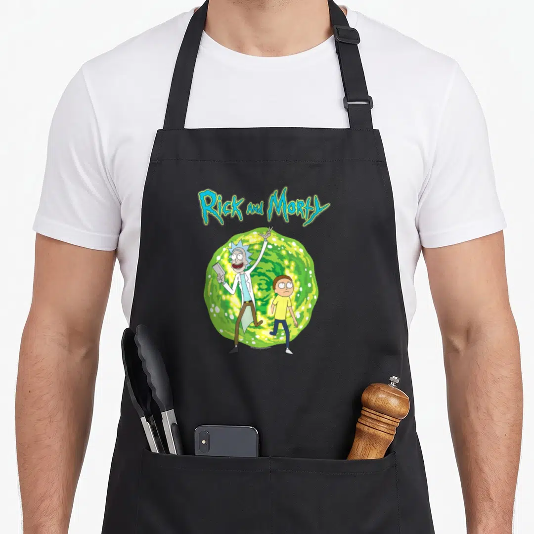 Dimension general apron - Rick and Morty stepping from green portal with blue title text — shown on a black cotton canvas apron against a white background